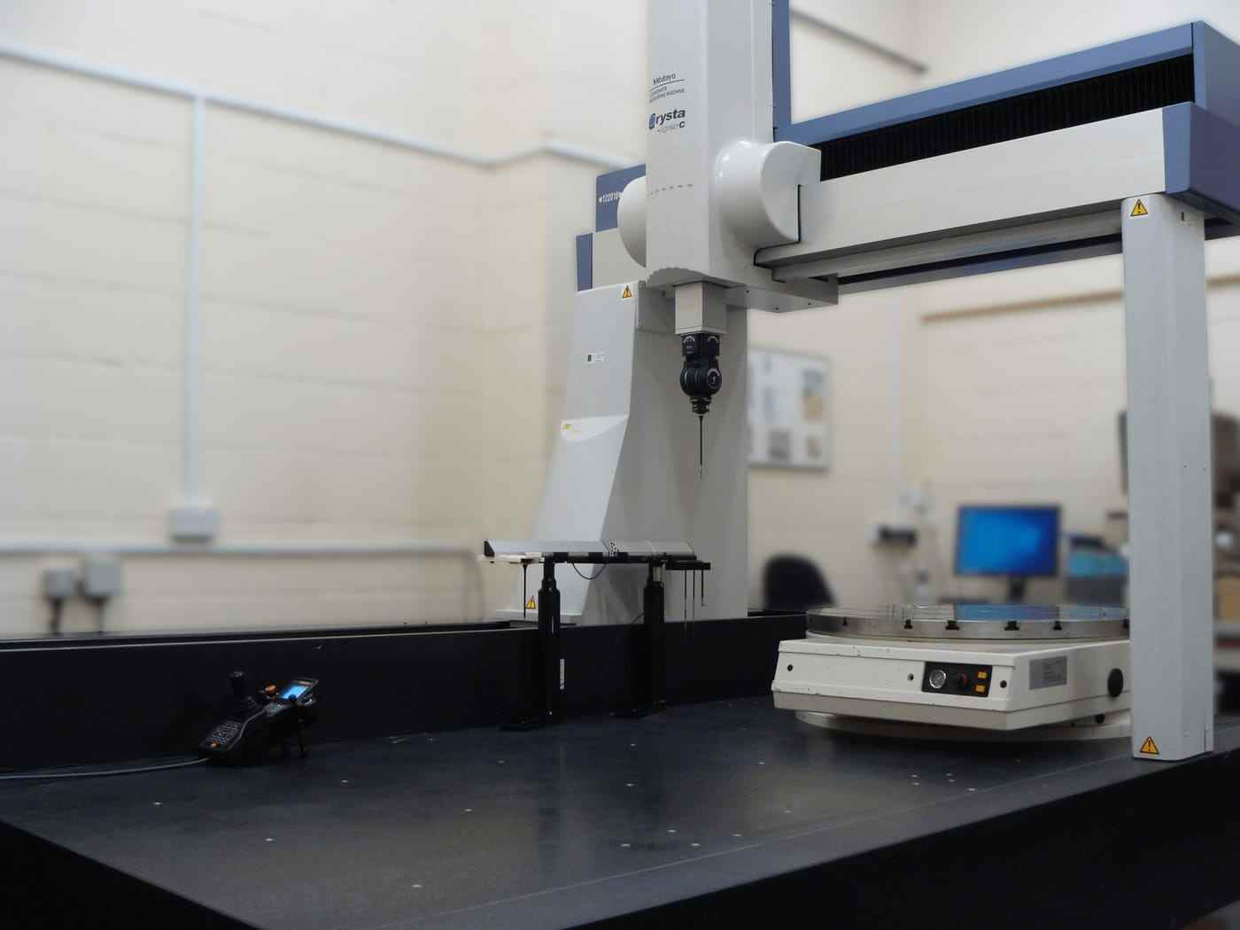 A bridge-type coordinate measuring machine in a clean inspection room